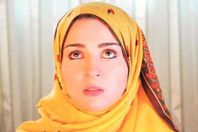 مي عز الدين بالحجاب في أحد أعمالها الفنية