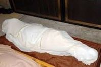 جثة ربة منزل 
