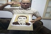 الشيف خالد يصمم صورة الشهيد "الحوفي"