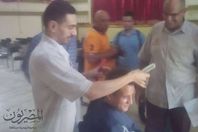 مدير مدرسة يستعين بـ " حلاق " لقص شعر الطلاب فى المحلة الكبرى