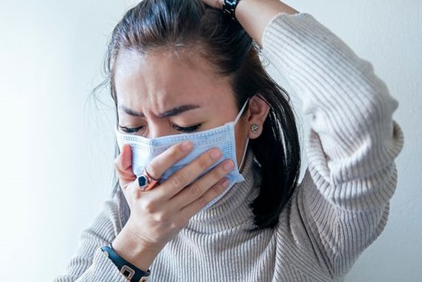 0_Asian-woman-with-face-mask-protection-of-Coronavirus-in-human-lungs