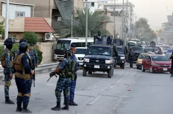 قوات أمنية عراقية تنتشر بأحد الشوارع خلال مظاهرة خرجت في أيلول الماضي ببغداد