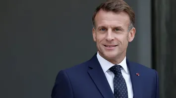 Macron Agrees to Freeze Pension Law to Avoid New Government Crisis