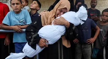 A Gazan Woman Bids Farewell to Her Martyred Son – Archive
