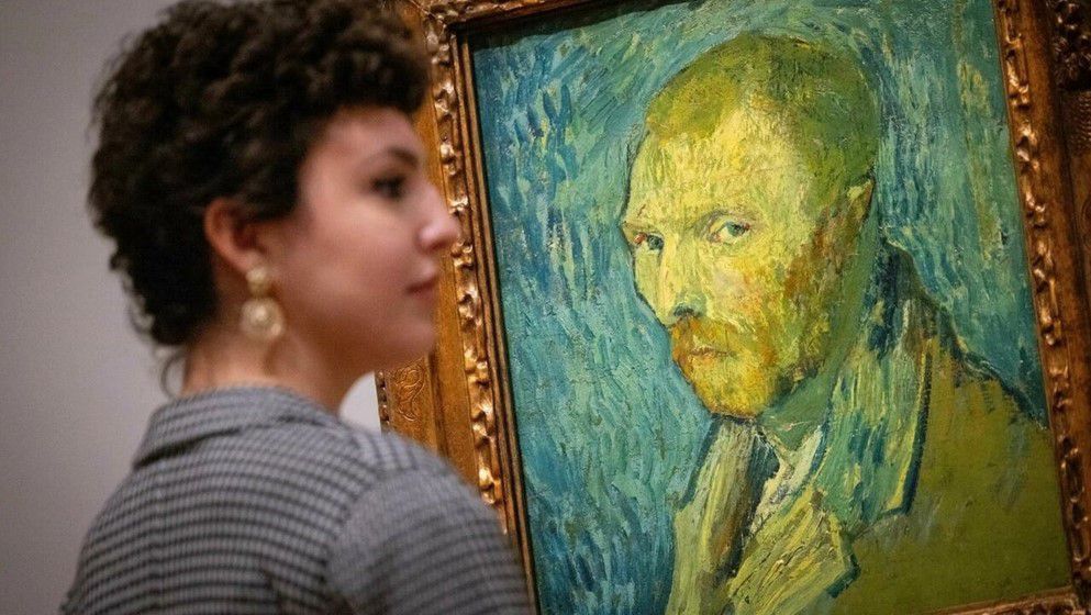 Climate activists glue hands to Van Gogh frame in London galle...